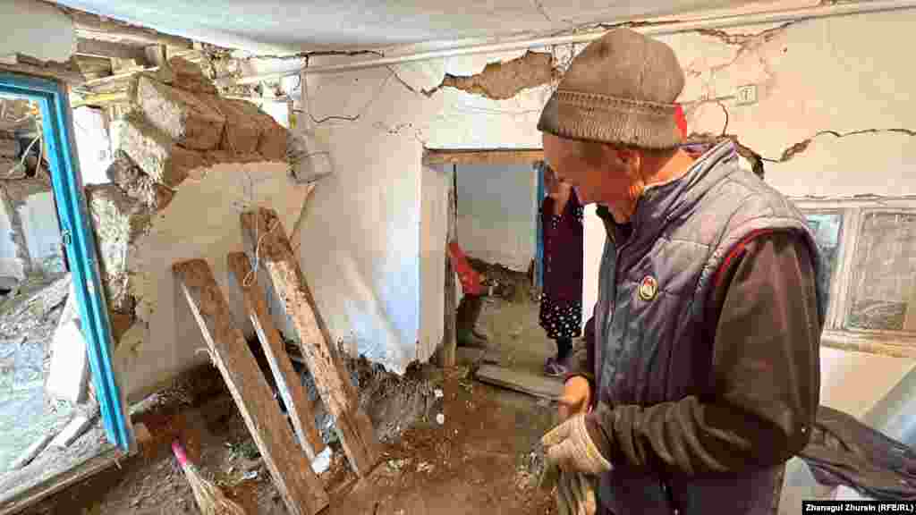 Another villager from Karatal, Madeniet Eleuov, is using wooden planks to support a partially collapsed wall in his flood-damaged home.&nbsp; Villagers are not only trying to salvage their homes but locate the livestock that they depend on for their livelihoods -- many of which have succumbed to the flooding and now lie scattered in the streets.