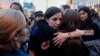 Women hug each other during a march for gender equality and against violence toward women, on International Women's Day, in Sofia, on March 8, 2019.