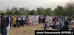 Afghan citizens are seen during a protest in Islamabad in February in which they asked the United States of to speed up the processing of their asylum cases.