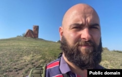 Gonzalez poses in front of the monument known as "Tatik-Papik" (Grandmother and Grandfather") in Nagorno-Karabakh.