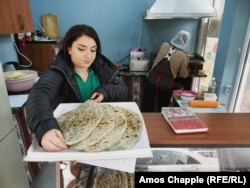 Gayane Petrosian, a mother of two who fled the village of Berkadzor in Nagorno-Karabakh, now runs a business baking jingalov hats in Echmiadzin, near Yerevan.