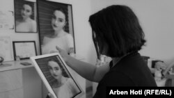 Milihate Cokli looks at a portrait of her daughter, Erona, who was murdered in April by her ex-husband.