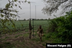 Members of the 22nd Mechanized Brigade prepare to launch a drone.