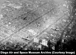 Three of the biplanes flying over New York.