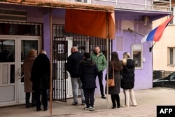 History of tensions: Locals wait outside the last branch of a bank in Leposavic in January 2024, one day before its closure as Pristina clamped down on use of dinars and Serbian-backed institutions in northern Kosovo.