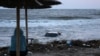 A woman looks at a car floating in the sea in the town of Tsarevo, on Bulgaria&#39;s Black Sea coast. on September 6.<br />
<br />
At least two men have died, and a search for a mother and child continues following <a href="https://www.svobodnaevropa.bg/a/dvama-muzhe-zaginali-pri-navodneniata-carevo/32580506.html" target="_self">torrential rains</a> that caused widespread flooding in the region.