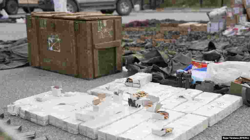 Crates of ammunition, a Serbian flag, and other confiscated items are displayed. Serbian President Aleksandar Vucic has denied that Belgrade was involved in the incident. He also repeated that Serbia would &quot;never&quot; recognize Kosovo&#39;s independence, &quot;neither formally nor informally.&quot;