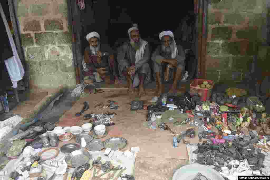 Afghan shopkeepers wait for customers at a shop at a refugee camp. The government&#39;s repatriation announcement comes amid a crackdown on Afghan refugees.&nbsp; &quot;The government has directed the police and other [law enforcement] organizations to arrest Afghans living illegally in Sindh and elsewhere in the country,&quot; Kamran Tissori, the governor of Sindh, told journalists on September 11. &nbsp;