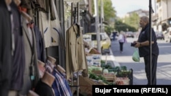 A man shops for vegetables in the Bosnian Quarter of North Mitrovica.