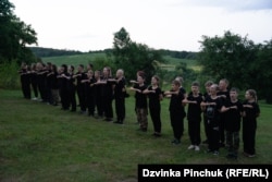 Children declaim the Prayer Of The Ukrainian Nationalist, a patriotic oath that is now popular among some military units in Ukraine.