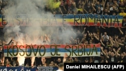 Romanian fans hold up a banner reading "Kosovo is Serbia" at the Euro 2024 qualifier match against Kosovo in Bucharest on September 12.