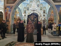 Military chaplain Danyil Tarnavskiy leads the first service after the transition of the Khmelnytskiy Cathedral.