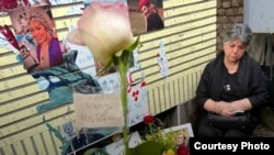 Fatemeh Mojtabai sits by the grave of her daughter Ghazaleh Chalabi, who was killed amid a brutal crackdown on anti-government protesters in Iran last year. 