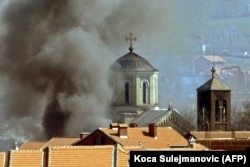 A Serbian Orthodox church in the northern town of Mitrovica burns in March 2004.