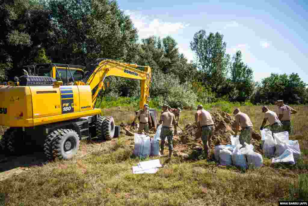 Approximately 50 Romanian soldiers participated in erecting the two shelters.