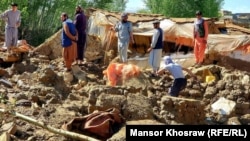 Afghans search through a building destroyed by heavy flooding earlier this month. Afghanistan has suffered a series of disastrous inundations this year