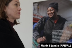 A woman reads a short story from one of the survivors rescued at sea.