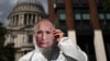 A protester with a face mask of Russian President Vladimir Putin takes part in a rally in London as part of the International "Putin Is A Killer" day of action across Europe on August 20.