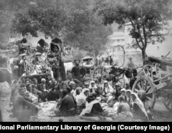 A group of travellers gather for a segregated meal at the Kvatakhevi monastery, near Tbilisi.