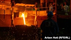 Newco Ferronikeli worker Sylejman Hajdari (right) watches nickel being processed.