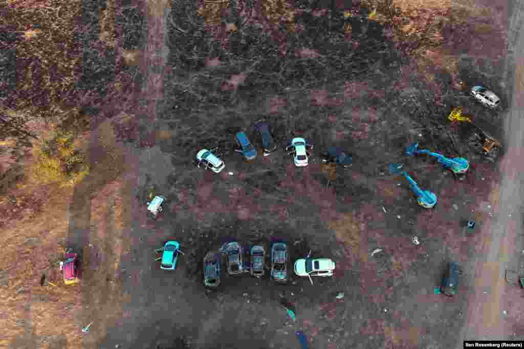 An aerial view shows burnt cars at the site of the attack on the Nova festival.