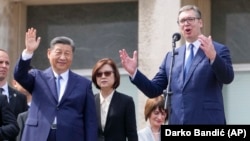 Xi Jinping (left) looks on as Serbian President Aleksandr Vucic speaks at the Palace of Serbia on May 8 during the Chinese leader's two-day visit to Belgrade.