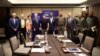 Ukrainian President Volodymyr Zelenskiy (center) poses with the bipartisan U.S. congressional delegation in Singapore on June 1.