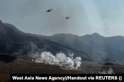 Explosions are seen during Iran's Might Iran drill in October 2022.