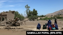 Women gather after flash floods in the village of Borka in the northern province of Baghlan in May.