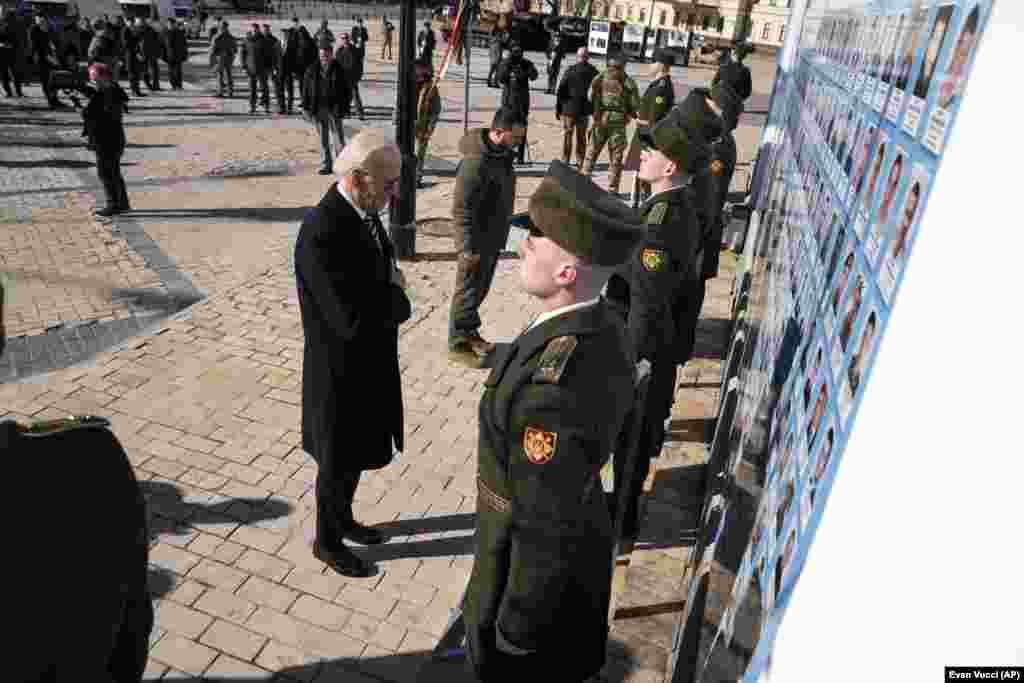 Biden (left) and Zelenskiy attend a wreath-laying ceremony at the Wall of Remembrance of the Fallen for Ukraine during the visit.