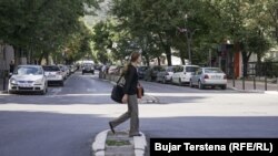 A woman crosses a street in North Mitrovica on October 11.