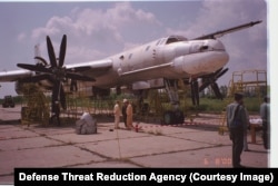 A Ukrainian Tu-95 strategic bomber being prepared for demolition in June 2000.