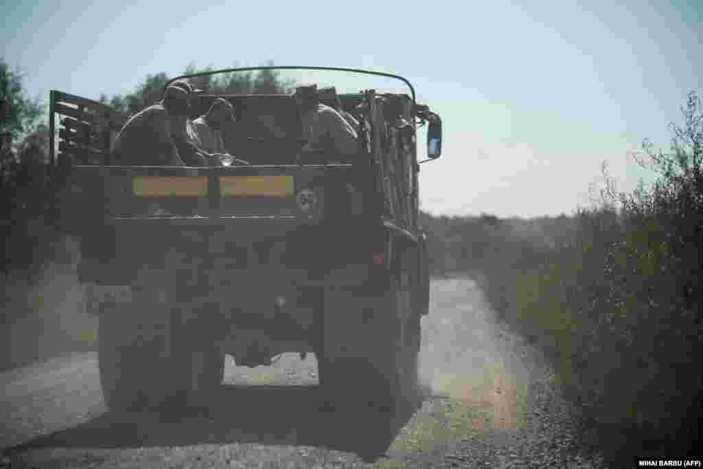 Romanian soldiers ride atop a truck after building the bomb shelters. Since Moscow&#39;s unprovoked full-scale invasion of Ukraine in February 2022, NATO has been focused on preventing the war from spilling over onto its territory.