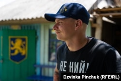 Illya Maryan, the head of the Call Of The Ravine camp, wears a T-shirt bearing its slogan, “Don’t Whine!”