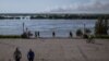 Smoke over the flooding Dnieper River can be seen from the elevation of Kherson's Glory Park. 