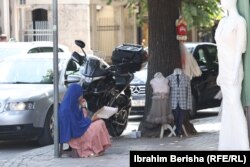 A young girl begs for money in the streets of Prizren, Kosovo.