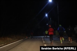 In the dark, Selimi runs with a group of like-minded people.