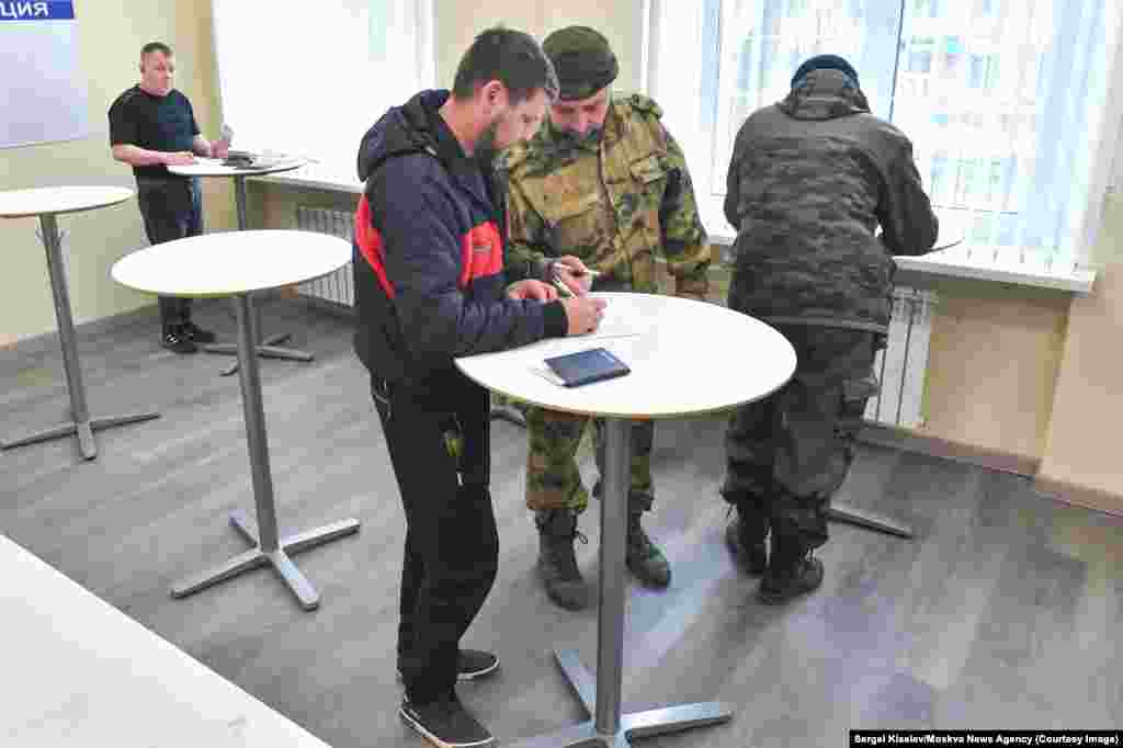 These images from Moscow&nbsp;were taken by photographers from the Kremlin-linked Moskva News Agency and appear to show men signing up for military contracts. The caption on this April 3 photo describes the scene as the &ldquo;opening of a selection point for contract service.&rdquo; &nbsp; 