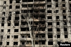 A view shows an apartment building heavily damaged by Russian military strikes in the town of Orikhiv, Zaporizhzhia region, on December 13, 2023.