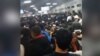 Migrants Wait In Line 'For Days' For Papers, Fearing Deportation From Russia