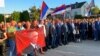 Bosnian Serb protesters carry portraits of Russian President Vladimir Putin as they rally in support of leader Milorad Dodik in East Sarajevo in September 2023. 