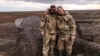 Russian soldiers pose for a photo on the line of fortifications northeast of the city of Tokmak, Zaporizhzhya region, Ukraine.