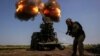 A Ukrainian soldier fires a self-propelled howitzer toward Russian troops at a position near the city of Bakhmut on July 5.