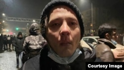 Author Daniyar Moldabekov after police tear-gassed Kazakhstan's largest-ever protest in Almaty on the night of January 4-5, 2022.