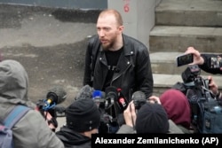 Daniil Berman, Gershkovich's lawyer, speaks to journalists near the court in Moscow on March 30.