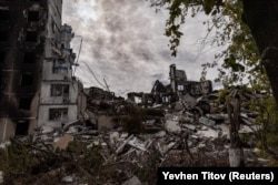 Apartment buildings are seen damaged or destroyed by a Russian military strike on Vuhledar in eastern Ukraine's Donetsk region in October 2023.