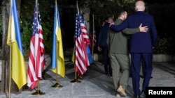 U.S President Joe Biden (right) walks with Ukrainian President Volodymyr Zelenskiy after a bilateral meeting on the sidelines of the G7 summit in Fasano, Italy, on June 13.