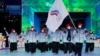 Olga Fatkulina and Vadim Shipachyov of the Russian Olympic Committee carry a flag into the stadium during the opening ceremony of the 2022 Winter Olympics, on February 4, 2022, in Beijing.