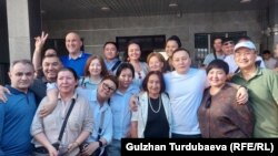 The Kempir-Abad activists in a celebratory photo after the court decision that freed them.