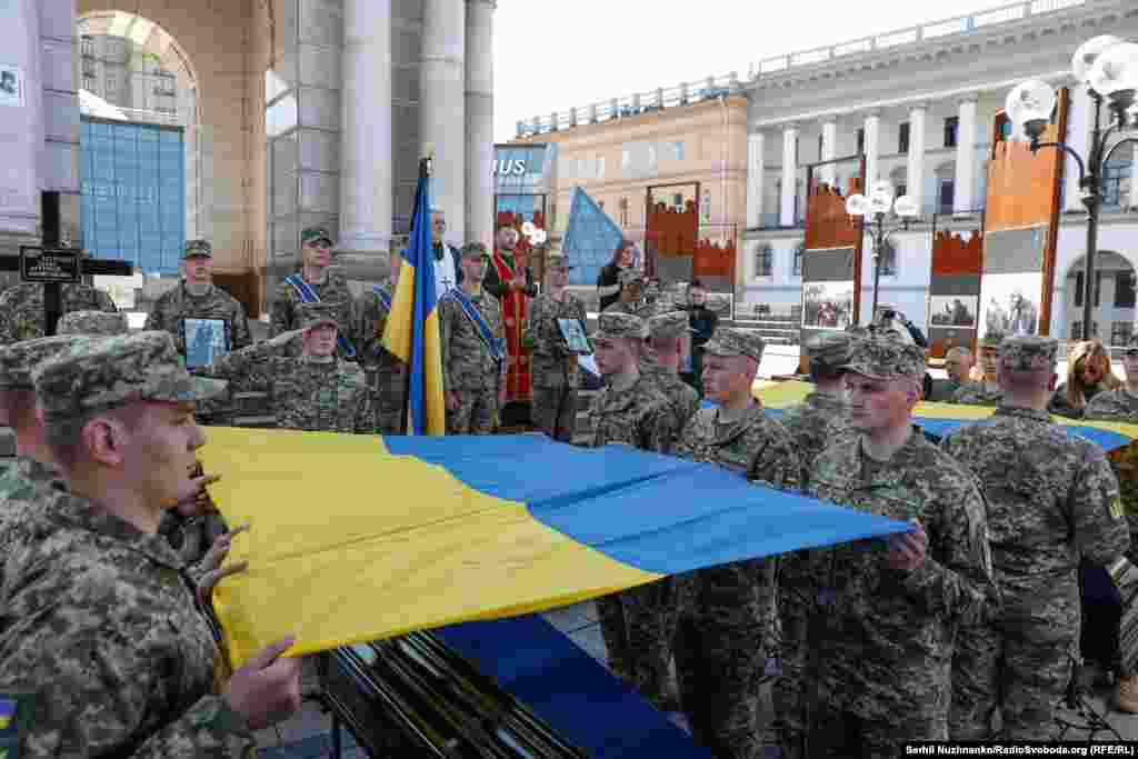 Honor guards prepare to fold two flags that were presented to the soldiers families.